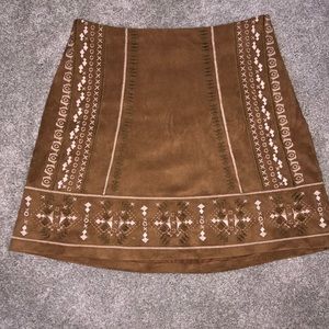 Faux suede tan mini skirt with Aztec embroidery